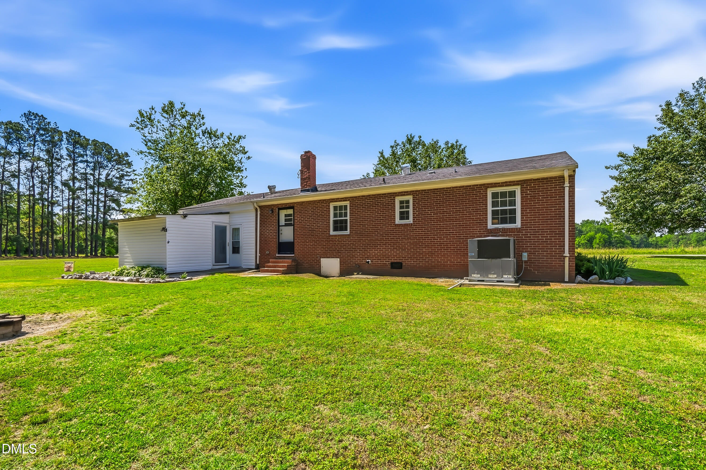 4967 Highway 581 Spring Hope, NC 27882 - Photo 15 of 44 a front view of a house with garden