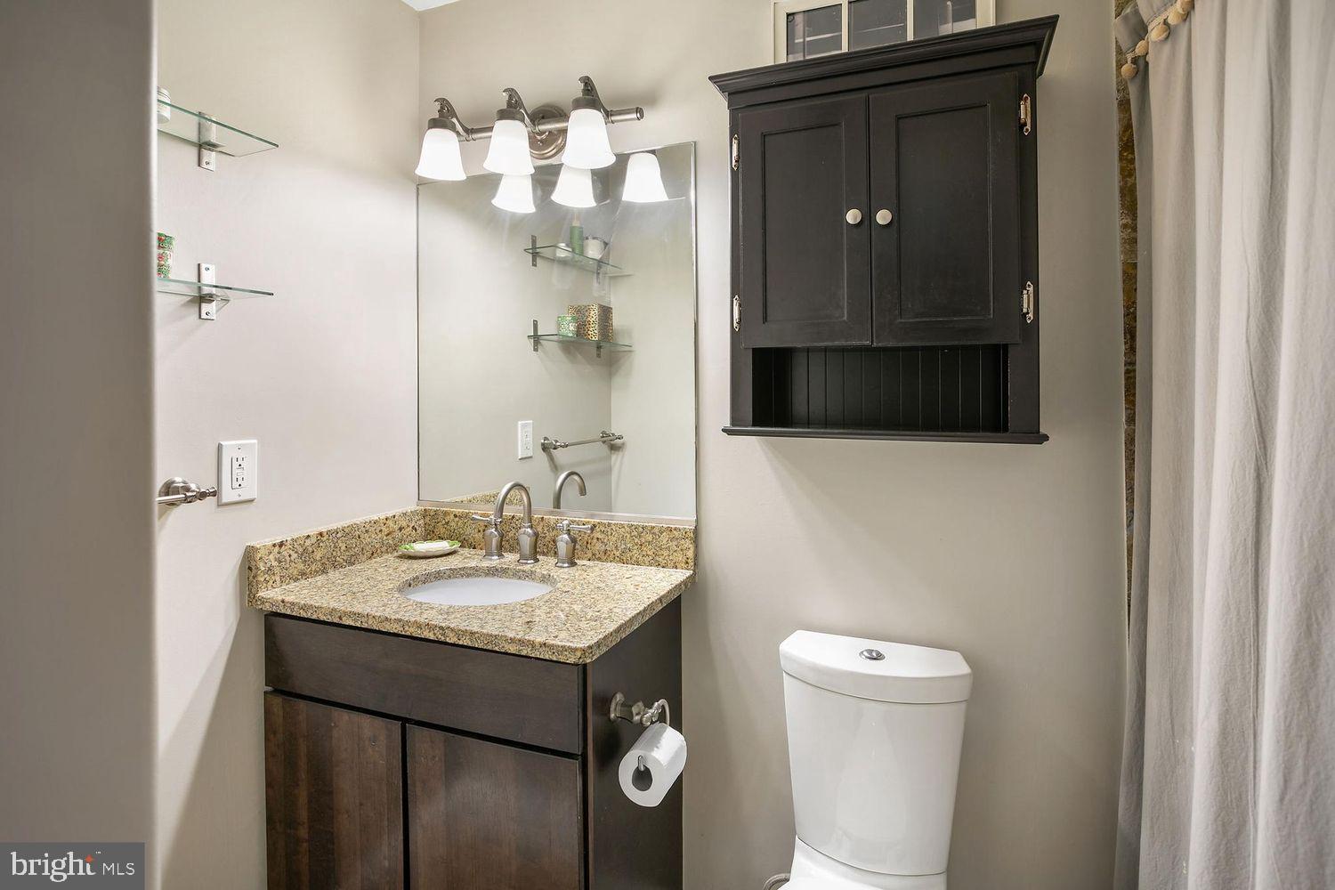 2650 15th Street Northwest, Unit 2 Washington, DC 20009 - Photo 14 of 25 a bathroom with a sink a toilet and shower