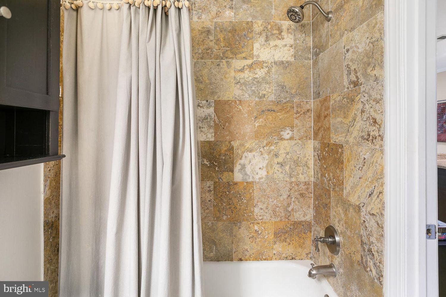 2650 15th Street Northwest, Unit 2 Washington, DC 20009 - Photo 15 of 25 a bathroom with a shower and a tub