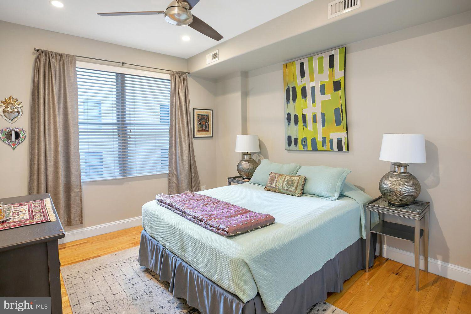 2650 15th Street Northwest, Unit 2 Washington, DC 20009 - Photo 19 of 25 a bedroom with a bed and a chandelier