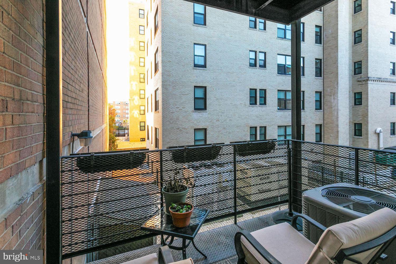 2650 15th Street Northwest, Unit 2 Washington, DC 20009 - Photo 22 of 25 a balcony with table and chairs