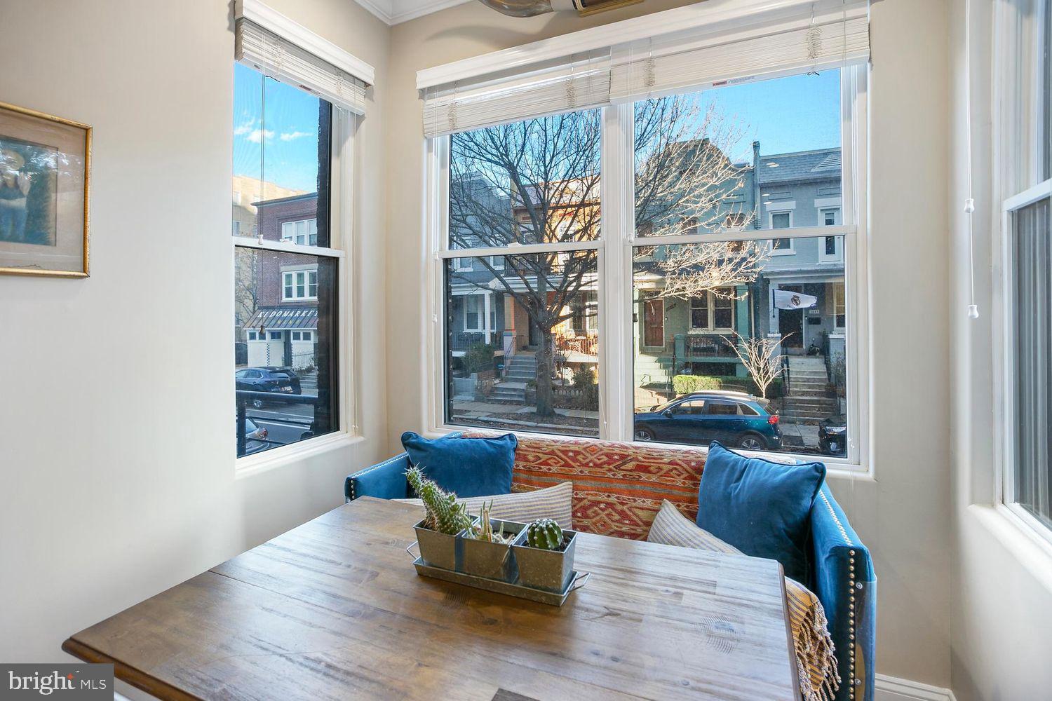 2650 15th Street Northwest, Unit 2 Washington, DC 20009 - Photo 5 of 25 a living room with furniture wooden floor and a large window