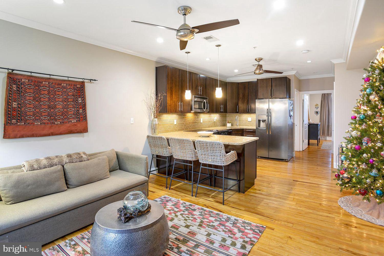 2650 15th Street Northwest, Unit 2 Washington, DC 20009 - Photo 8 of 25 a living room with furniture and a chandelier