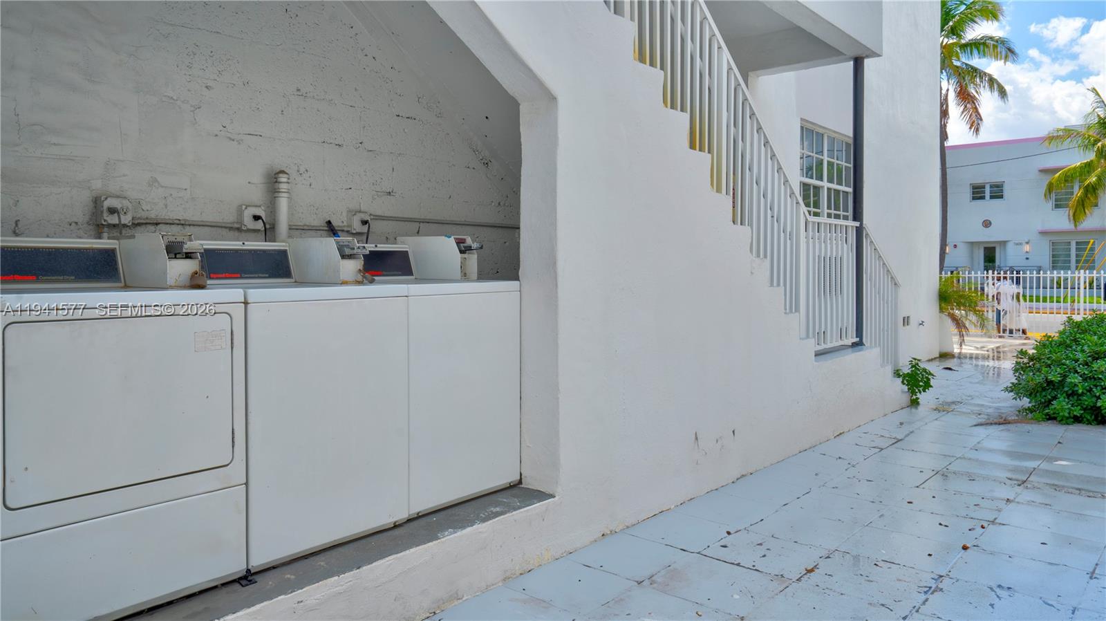 7611 Harding Avenue, Unit 7 Miami Beach, FL 33141 - Photo 2 of 11 a view of storage and utility room with washer and dryer