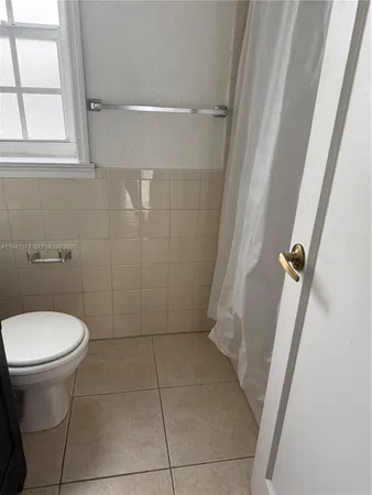 a bathroom with a sink and toilet
