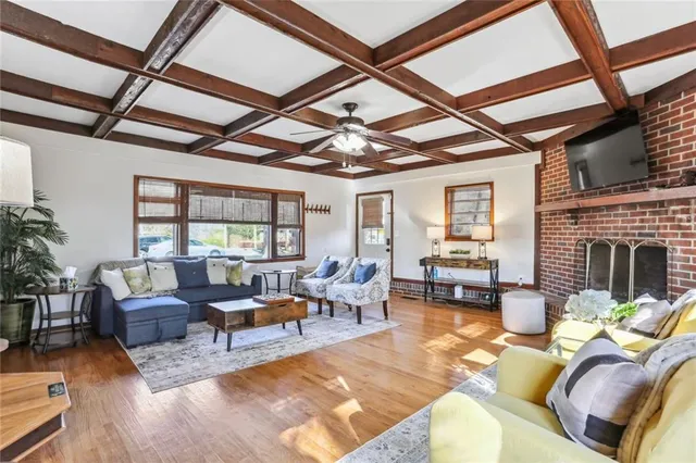 a living room with furniture or fireplace and a wooden floor