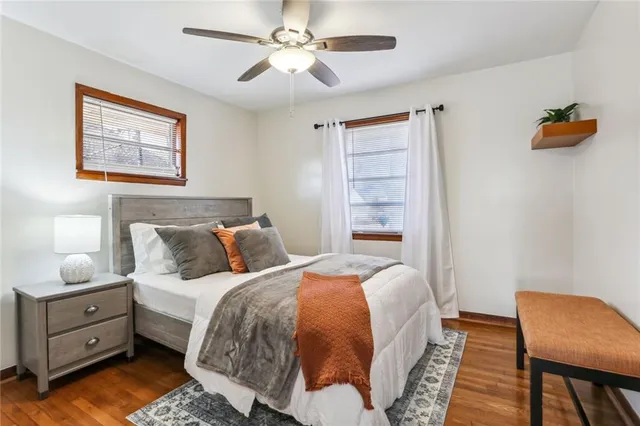 a bed room with a bed and a chair