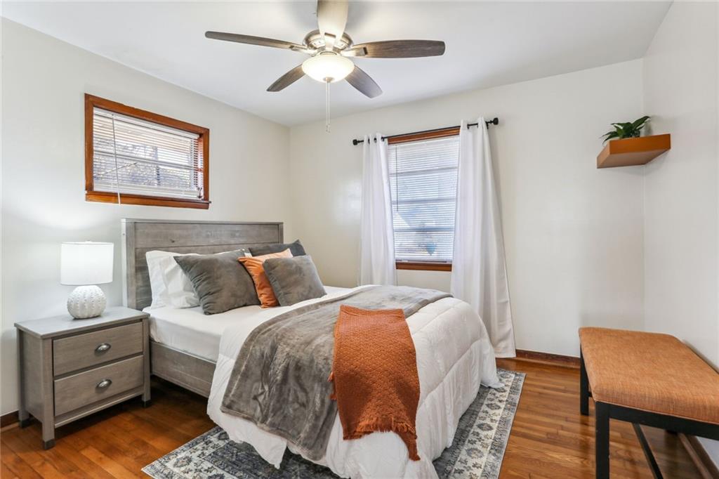 4667 Glore Road Southwest Mableton, GA 30126 - Photo 16 of 46 a bed room with a bed and a chair