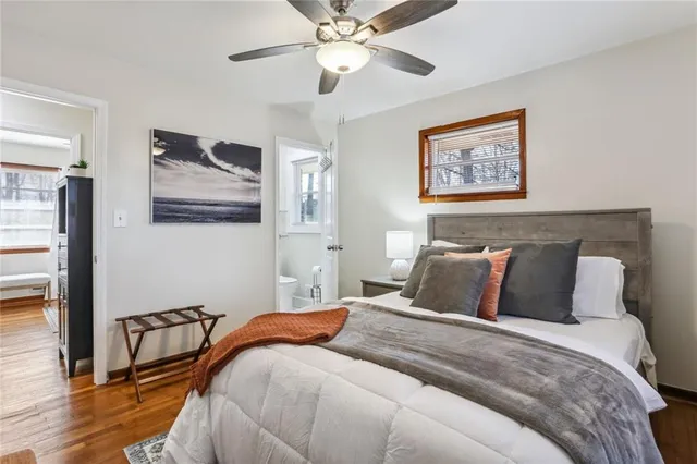 a bedroom with bed and a window