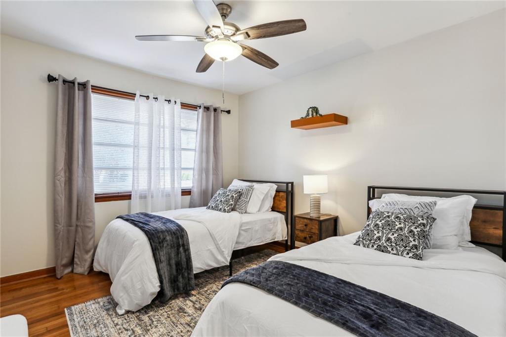 4667 Glore Road Southwest Mableton, GA 30126 - Photo 21 of 46 a bedroom with two beds and ceiling fan