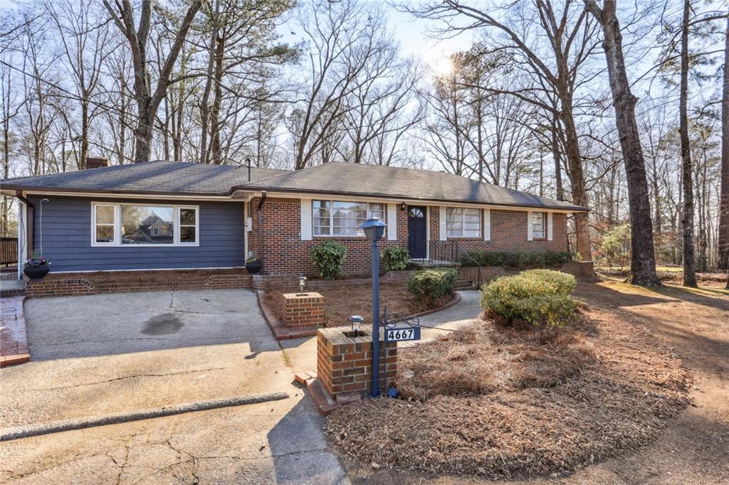 4667 Glore Road Southwest Mableton, GA 30126 - Photo 29 of 46 a view of a house with backyard and sitting area