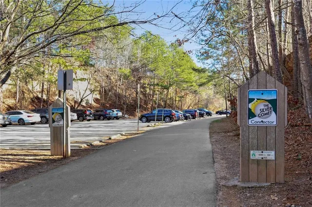 a view of a street with a building and a street sign