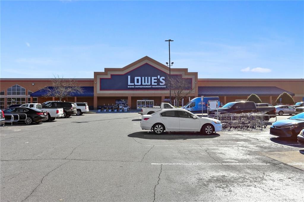 4667 Glore Road Southwest Mableton, GA 30126 - Photo 39 of 46 a car parked in front of a building