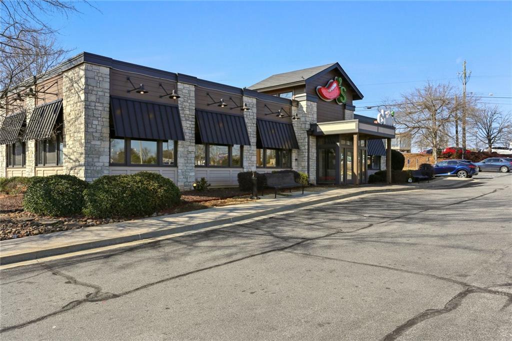 4667 Glore Road Southwest Mableton, GA 30126 - Photo 41 of 46 front view of a building with a street