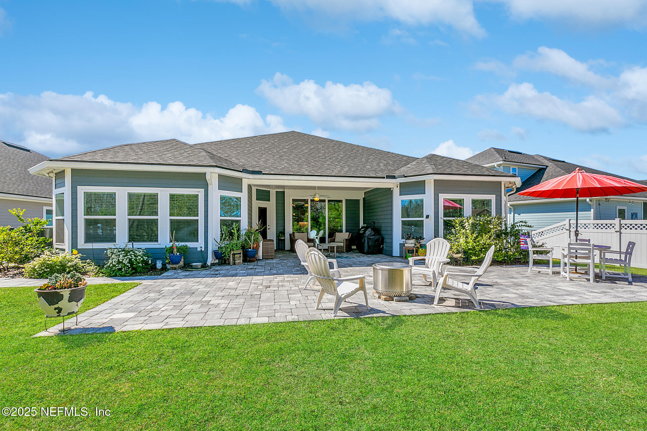 125 Holly Forest Drive St. Augustine, FL 32092 - Photo 68 of 96 a view of a house with backyard sitting area and garden
