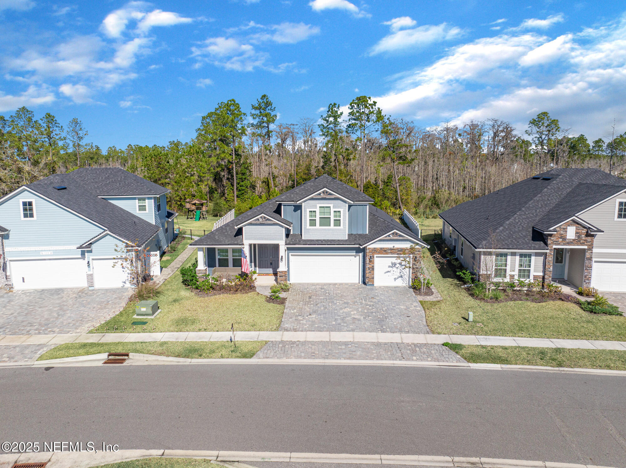 125 Holly Forest Drive St. Augustine, FL 32092 - Photo 71 of 96 a front view of a house with a garden and entryway