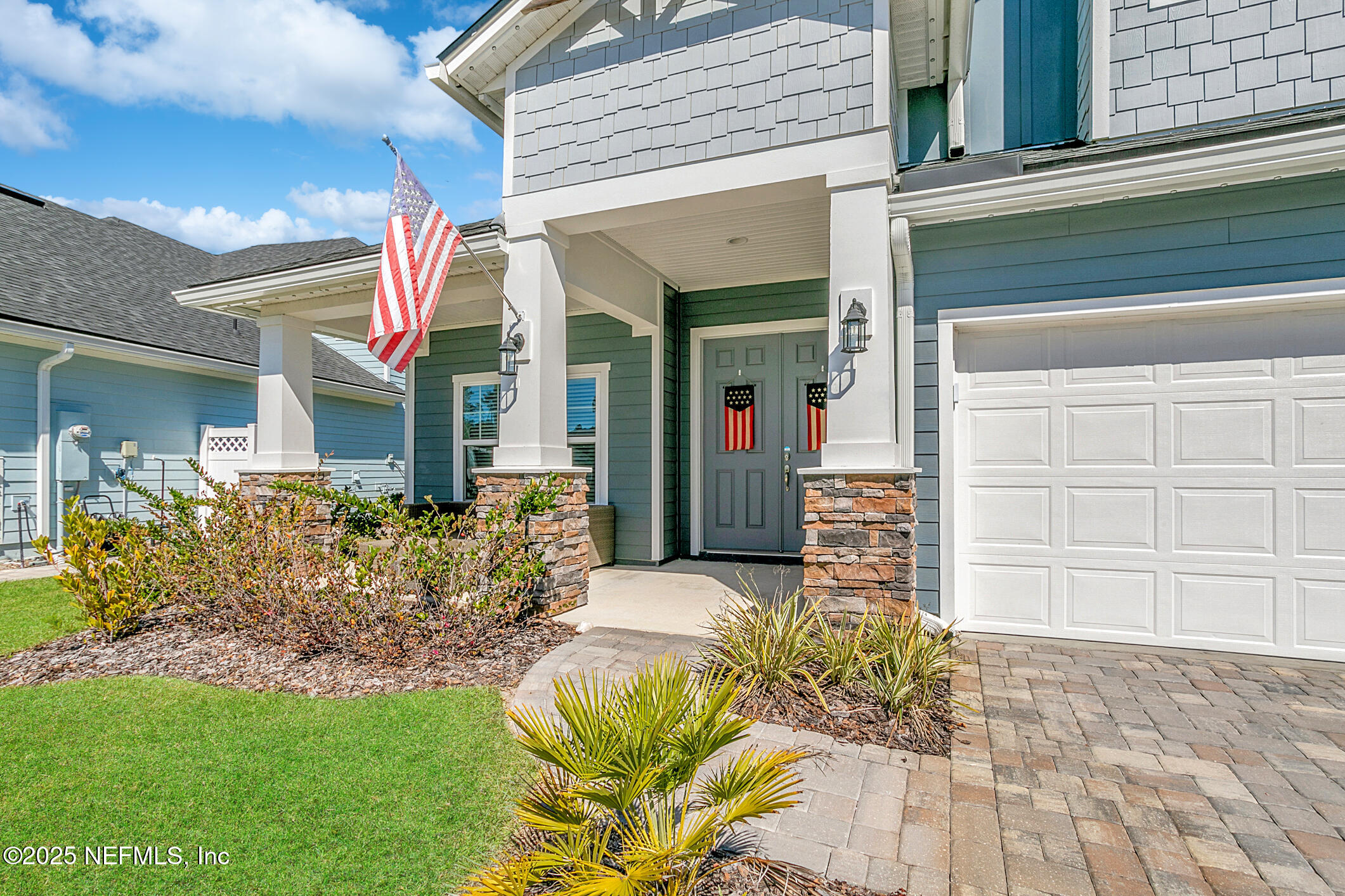 125 Holly Forest Drive St. Augustine, FL 32092 - Photo 9 of 96 a front view of a house with a garden