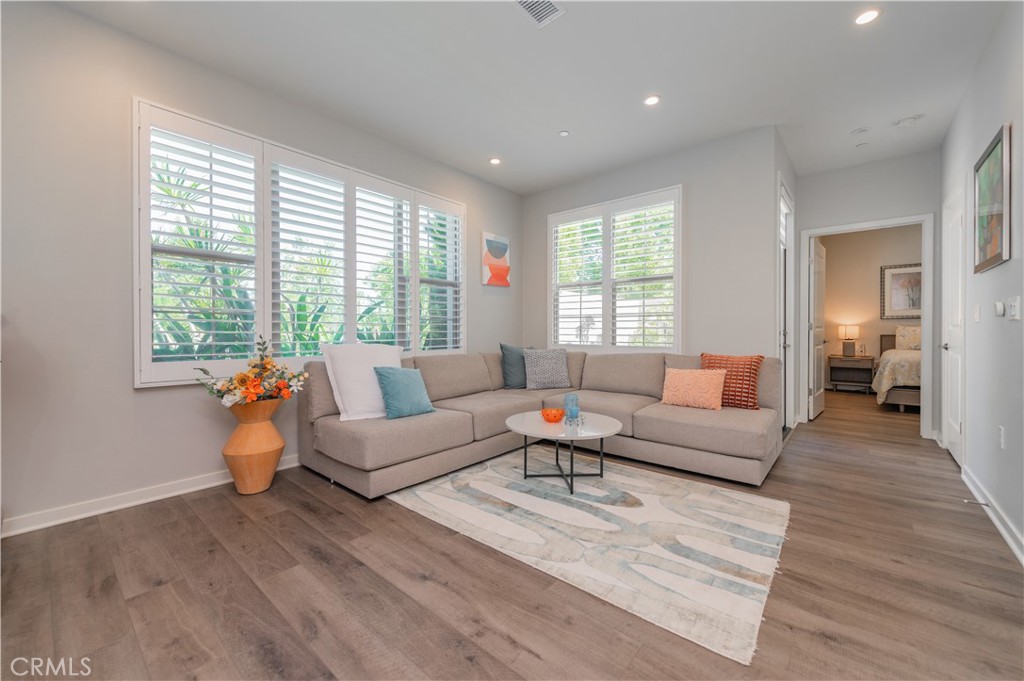a living room with furniture and a large window