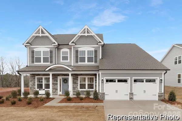a front view of a house with yard