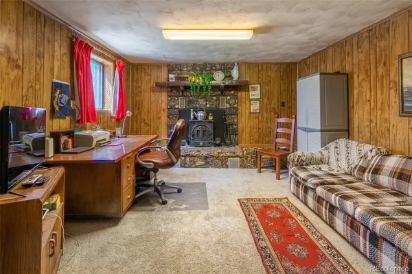 a bedroom with furniture and a window