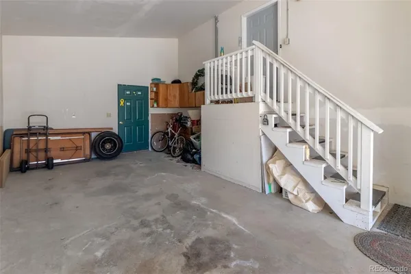 a view of livingroom with stairs and furniture