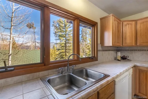 a kitchen with a sink and a window