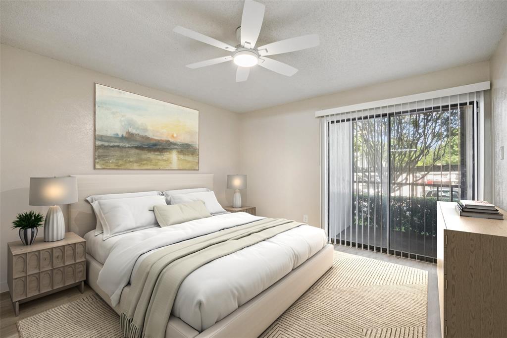 11480 Audelia Road, Unit 136 Dallas, TX 75243 - Photo 10 of 29 Bright room featuring a glass sliding door with vertical blinds, a ceiling fan, and light-toned wall finishes