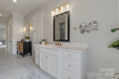 a bathroom with a double vanity sink and a mirror