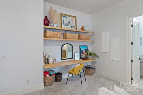 a bathroom with a granite countertop sink a toilet and shower