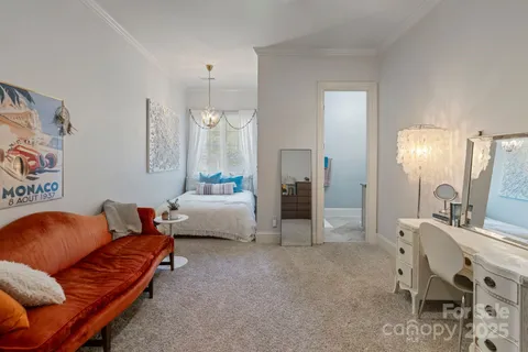 a bedroom with furniture and a bed