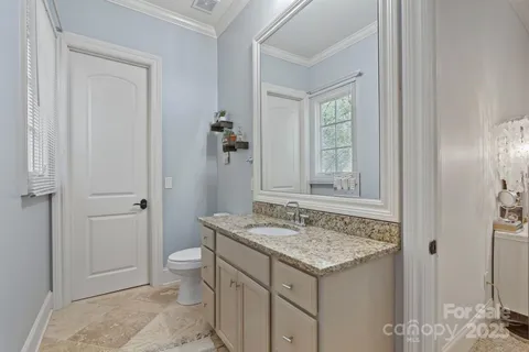 a spacious bedroom with a bed and a window