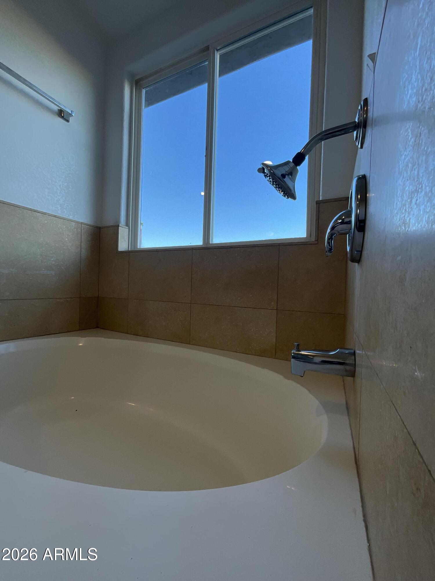 8052 West Pierson Street Phoenix, AZ 85033 - Photo 19 of 36 a bathroom with a bathtub