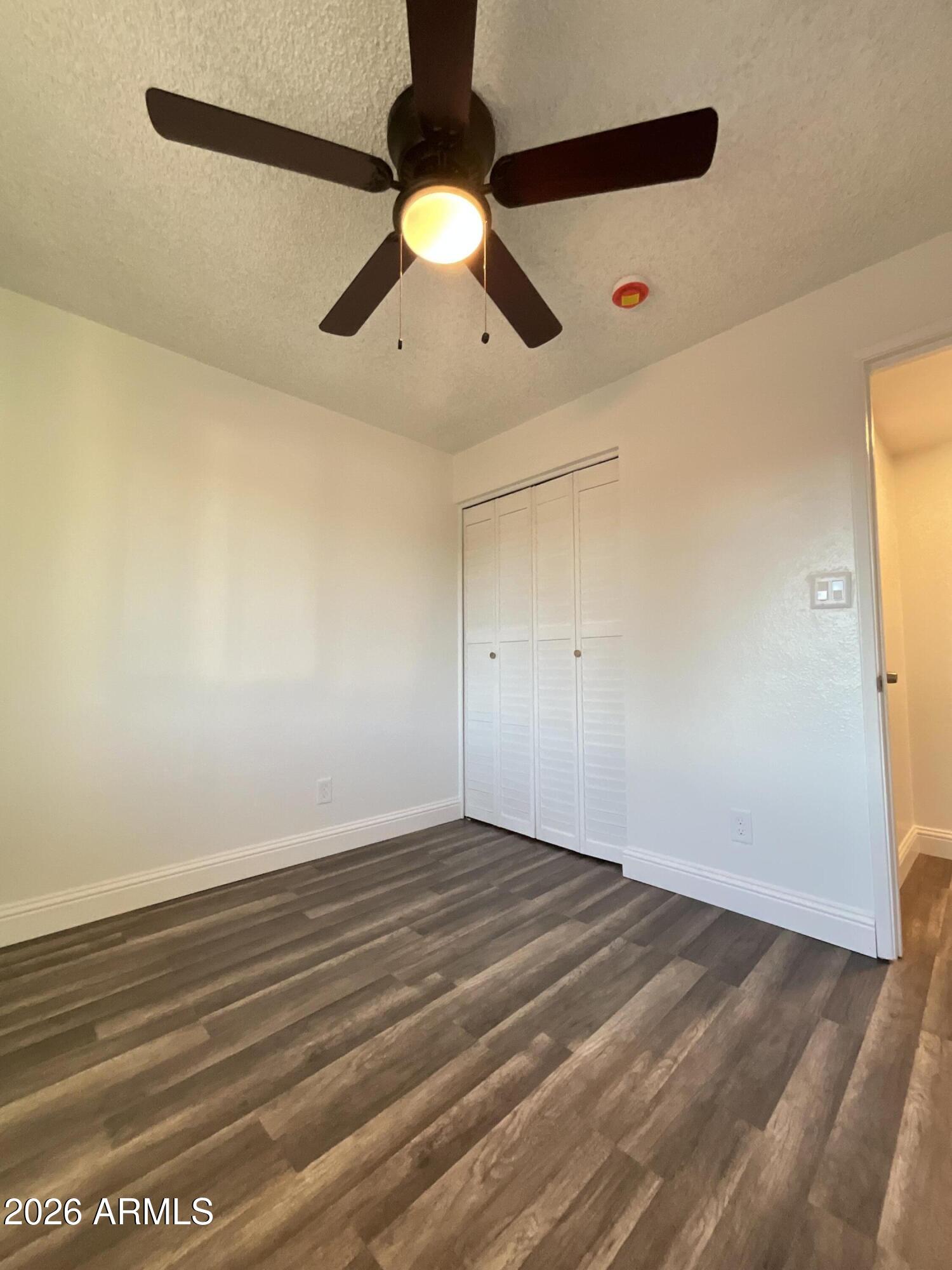 8052 West Pierson Street Phoenix, AZ 85033 - Photo 22 of 36 a view of a room with a ceiling fan