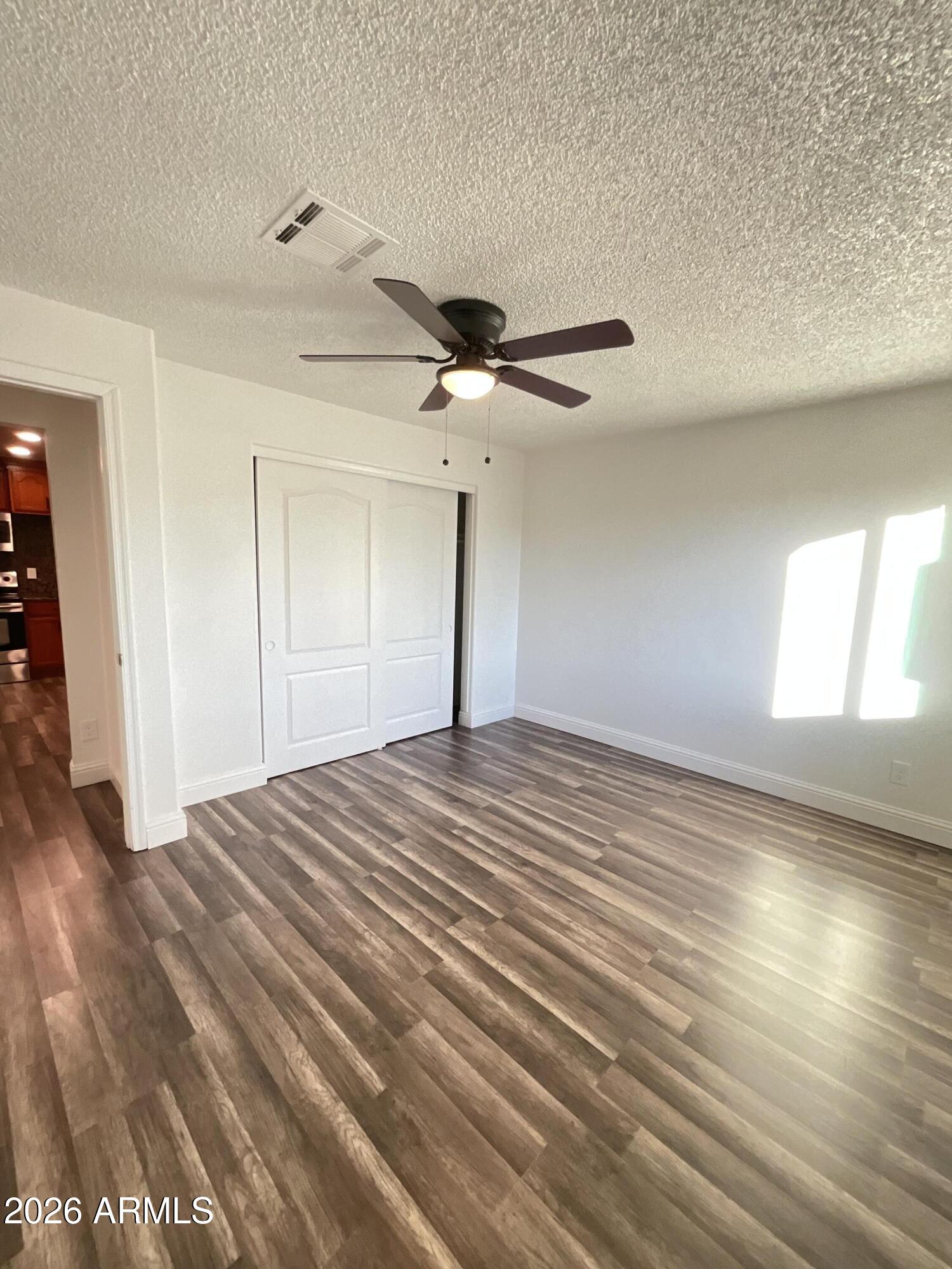 8052 West Pierson Street Phoenix, AZ 85033 - Photo 24 of 36 a view of a livingroom with a ceiling fan
