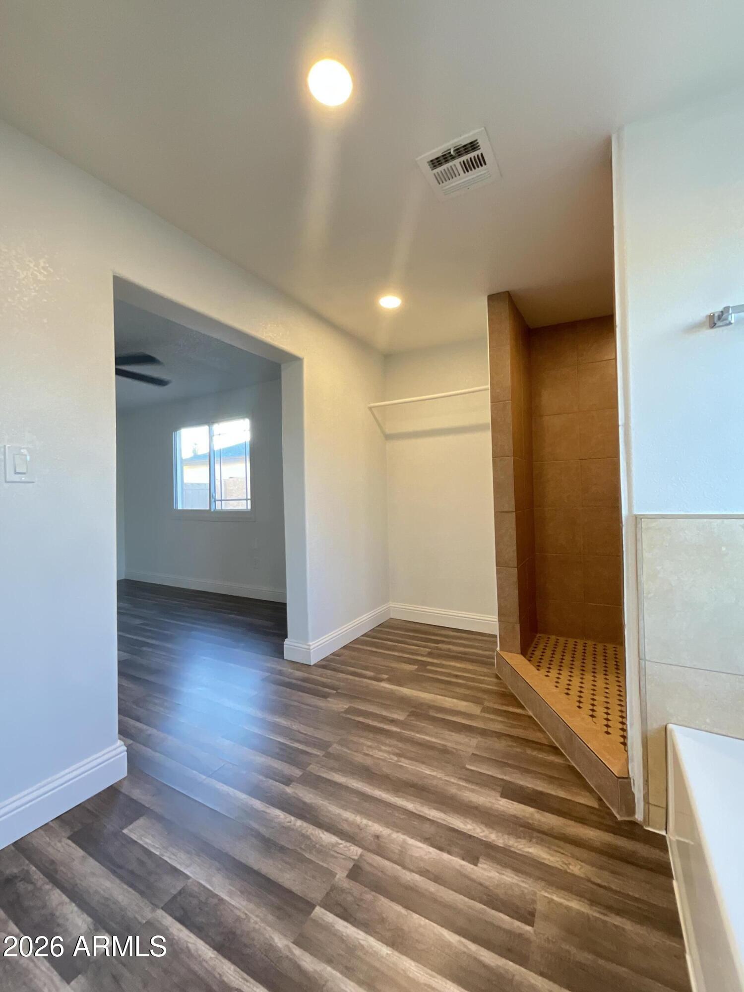 8052 West Pierson Street Phoenix, AZ 85033 - Photo 27 of 36 a view of wooden floor and windows in a room