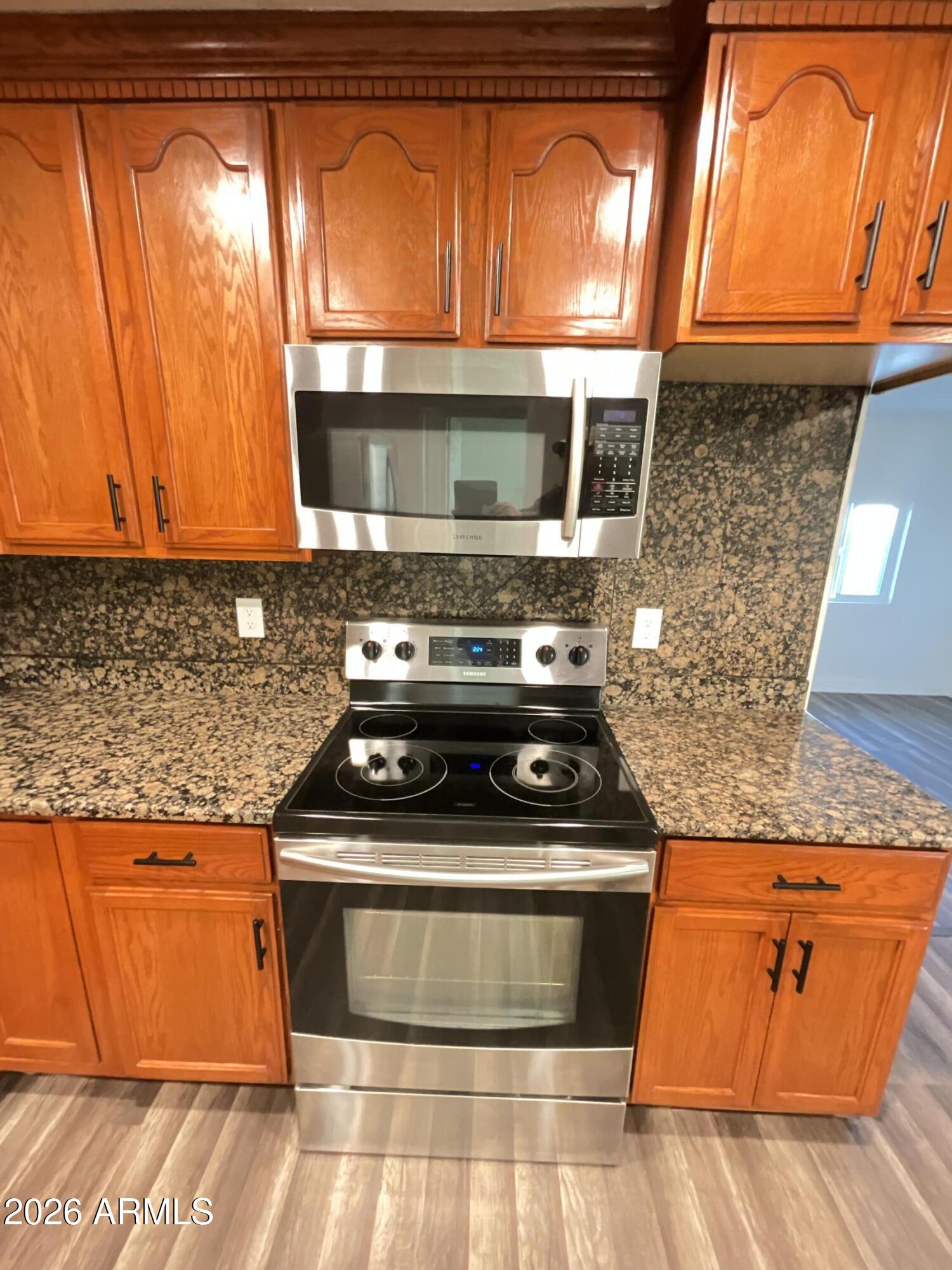 8052 West Pierson Street Phoenix, AZ 85033 - Photo 29 of 36 a stove top oven sitting inside of a kitchen