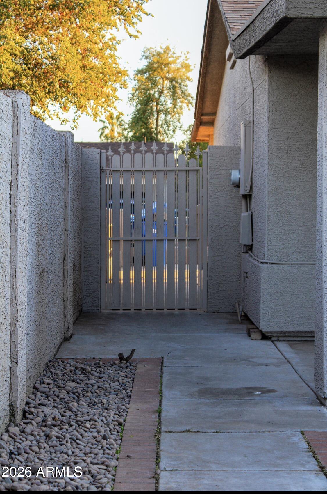 8052 West Pierson Street Phoenix, AZ 85033 - Photo 34 of 36 a view of a house with a wooden fence