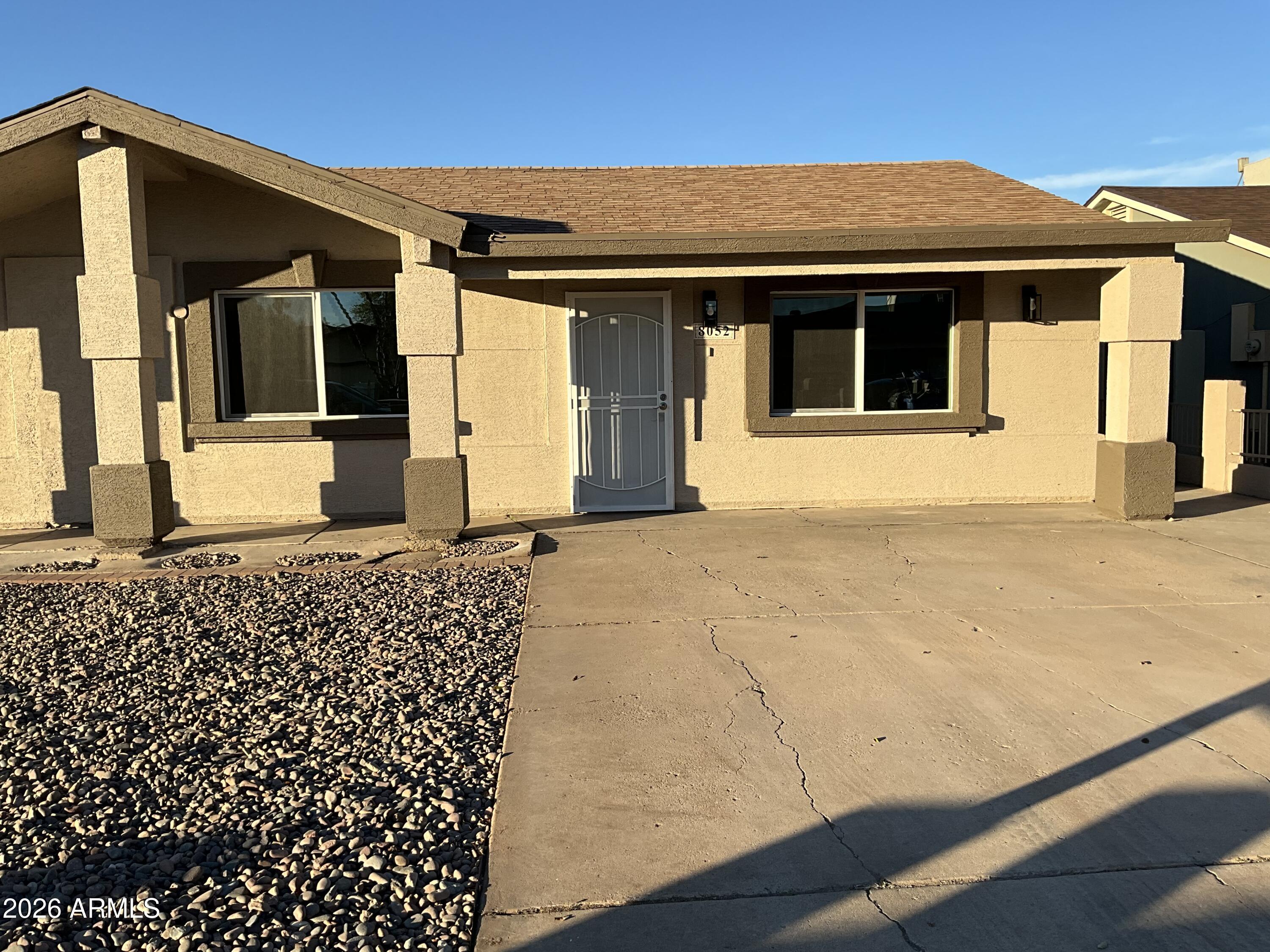8052 West Pierson Street Phoenix, AZ 85033 - Photo 7 of 36 a front view of a house with a large window