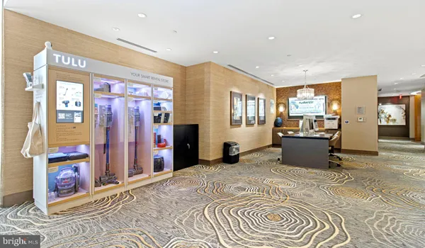 a kitchen with stainless steel appliances granite countertop a refrigerator a stove a sink and a refrigerator