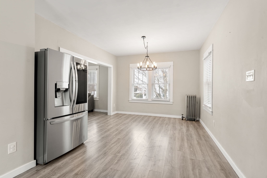 361 Prospect Avenue West Springfield, MA 01089 - Photo 12 of 35 a view of a kitchen with a sink refrigerator and wooden floor