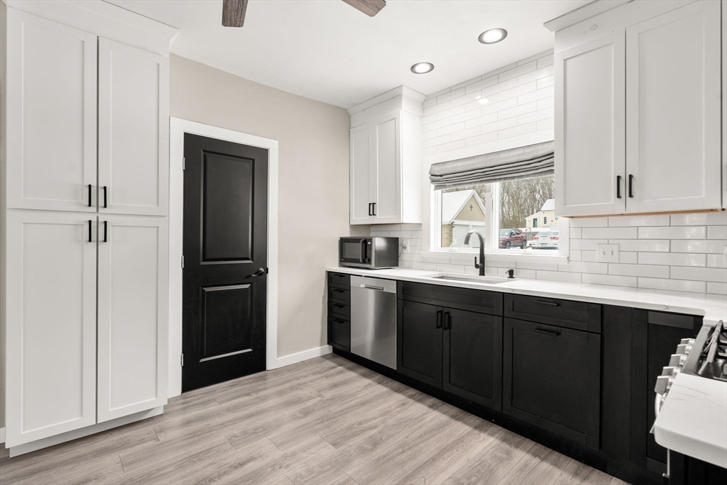 361 Prospect Avenue West Springfield, MA 01089 - Photo 13 of 35 a kitchen with a refrigerator sink and cabinets