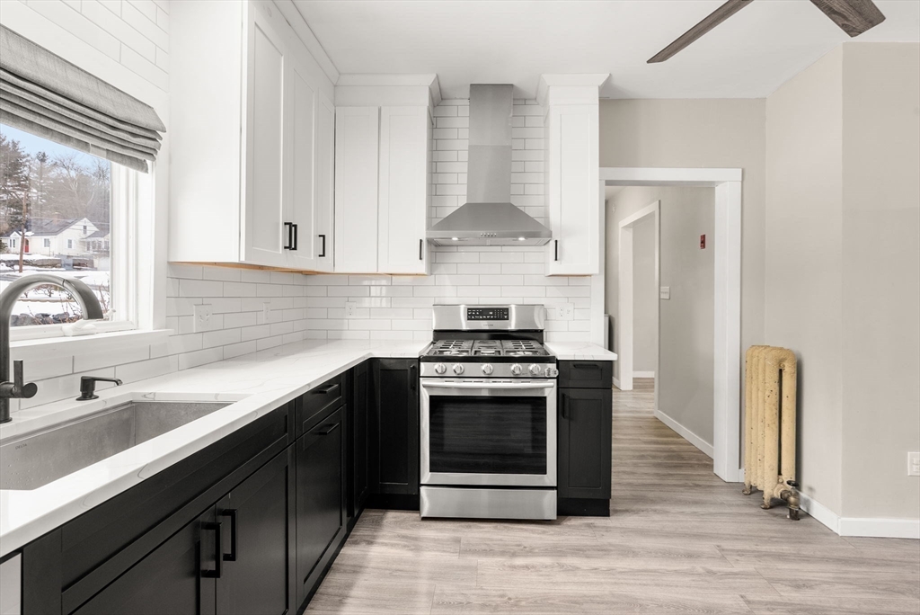 361 Prospect Avenue West Springfield, MA 01089 - Photo 15 of 35 a kitchen with stainless steel appliances granite countertop a stove and a sink