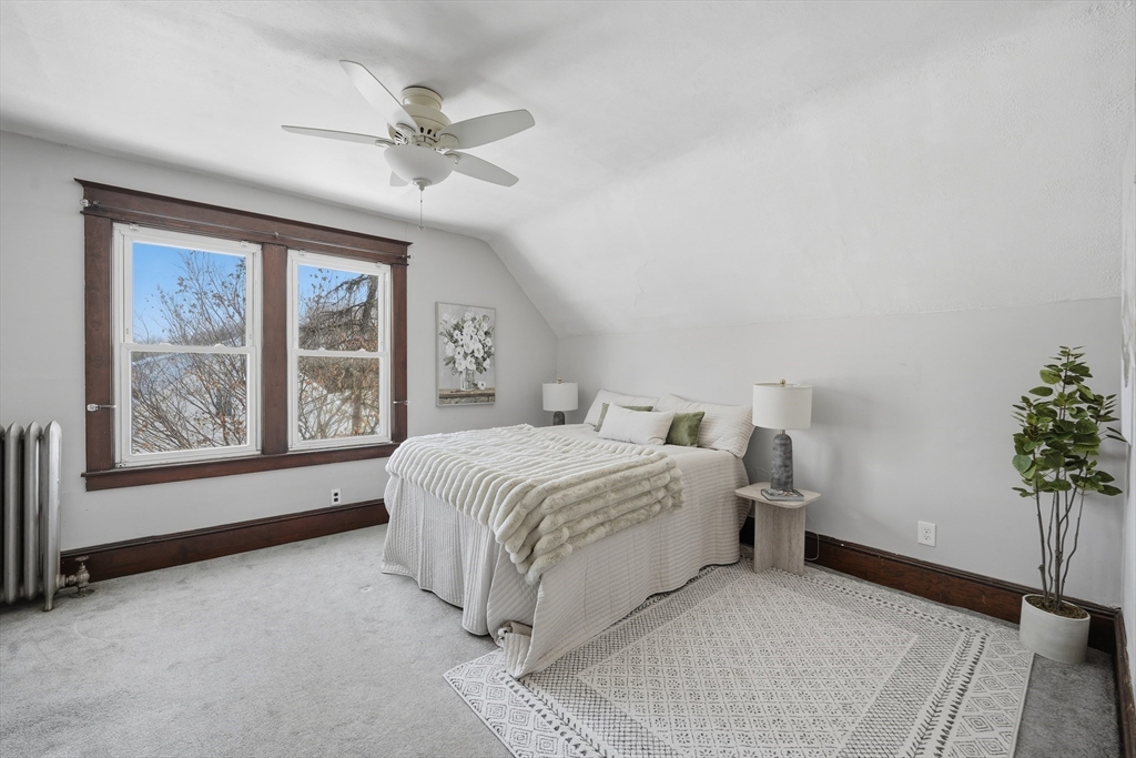 361 Prospect Avenue West Springfield, MA 01089 - Photo 24 of 35 a spacious bedroom with a bed and a potted plant