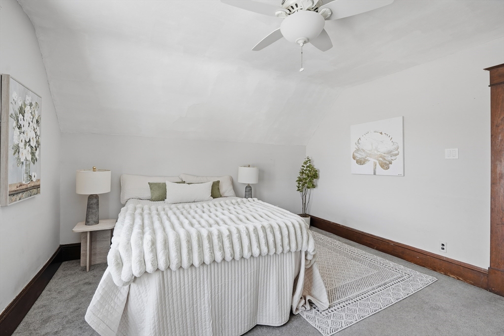 361 Prospect Avenue West Springfield, MA 01089 - Photo 25 of 35 a bedroom with a bed and a chandelier