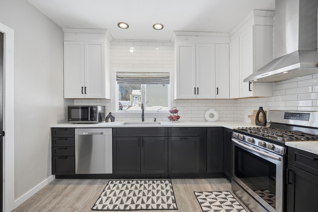 361 Prospect Avenue West Springfield, MA 01089 - Photo 9 of 35 a kitchen with stainless steel appliances a stove a sink and cabinets