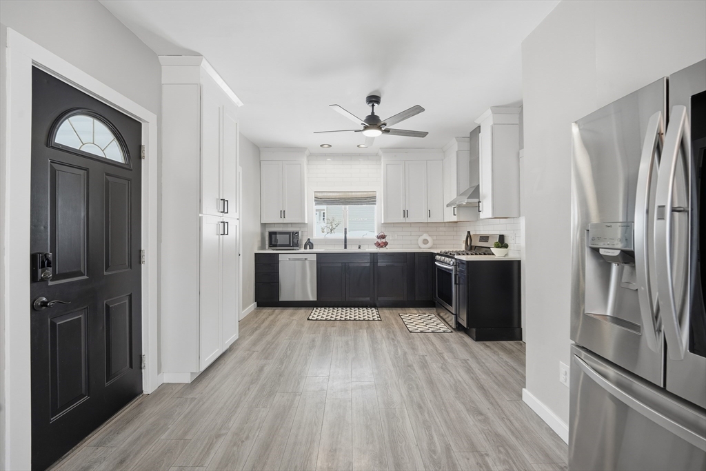 361 Prospect Avenue West Springfield, MA 01089 - Photo 10 of 35 a kitchen with stainless steel appliances granite countertop a refrigerator and a stove top oven