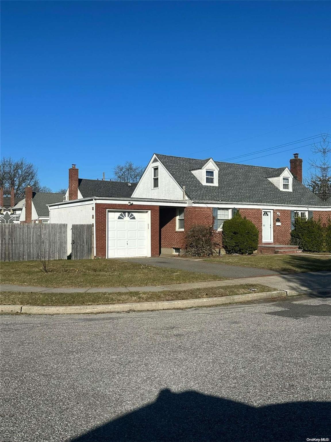 863 Harbor Circle Baldwin, NY 11510 - Photo 1 of 1 a front view of a house with a yard