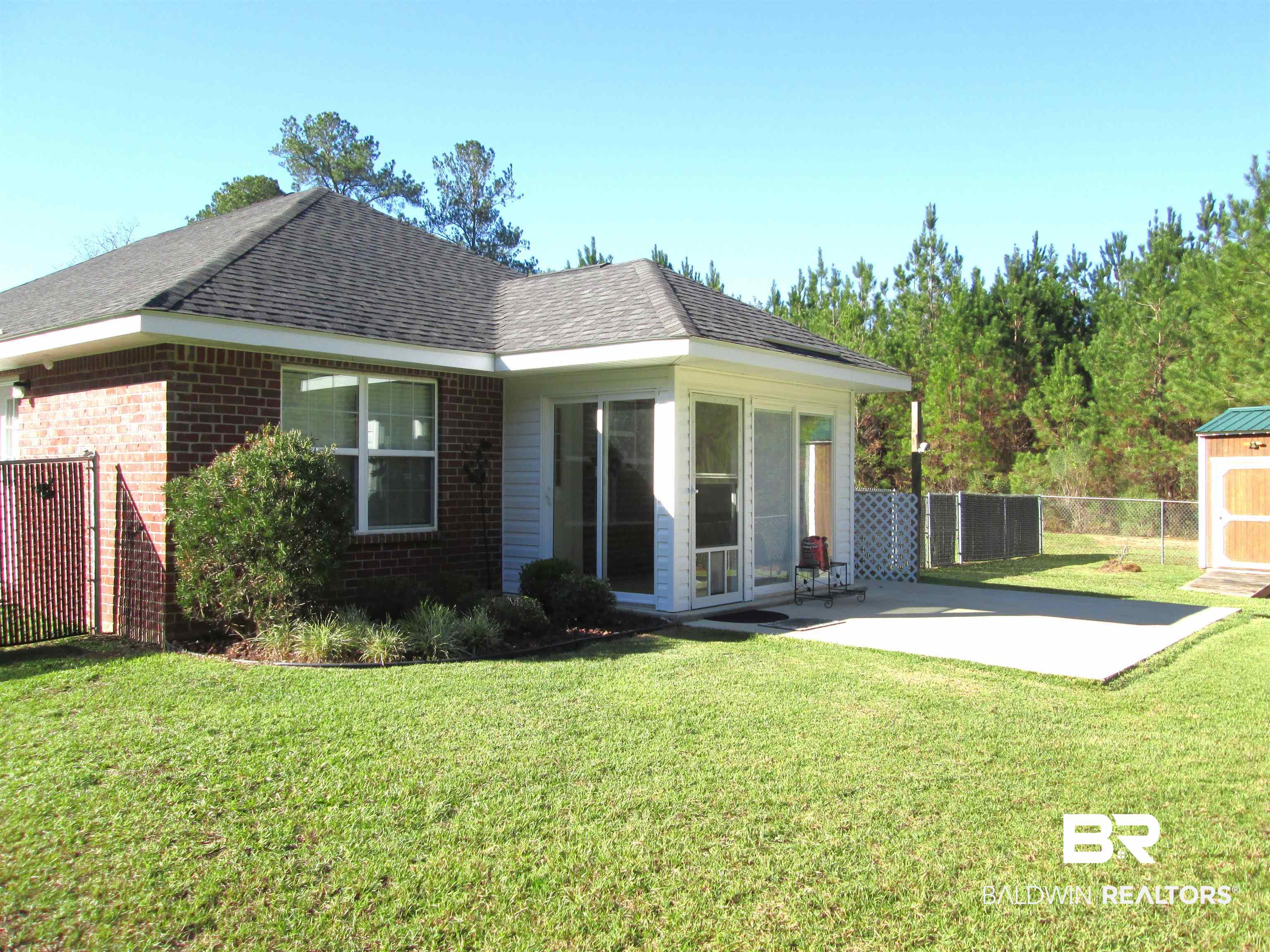 530 Brethren Church Road Fruitdale, AL 36539 - Photo 18 of 24 Back of property with a lawn and a patio