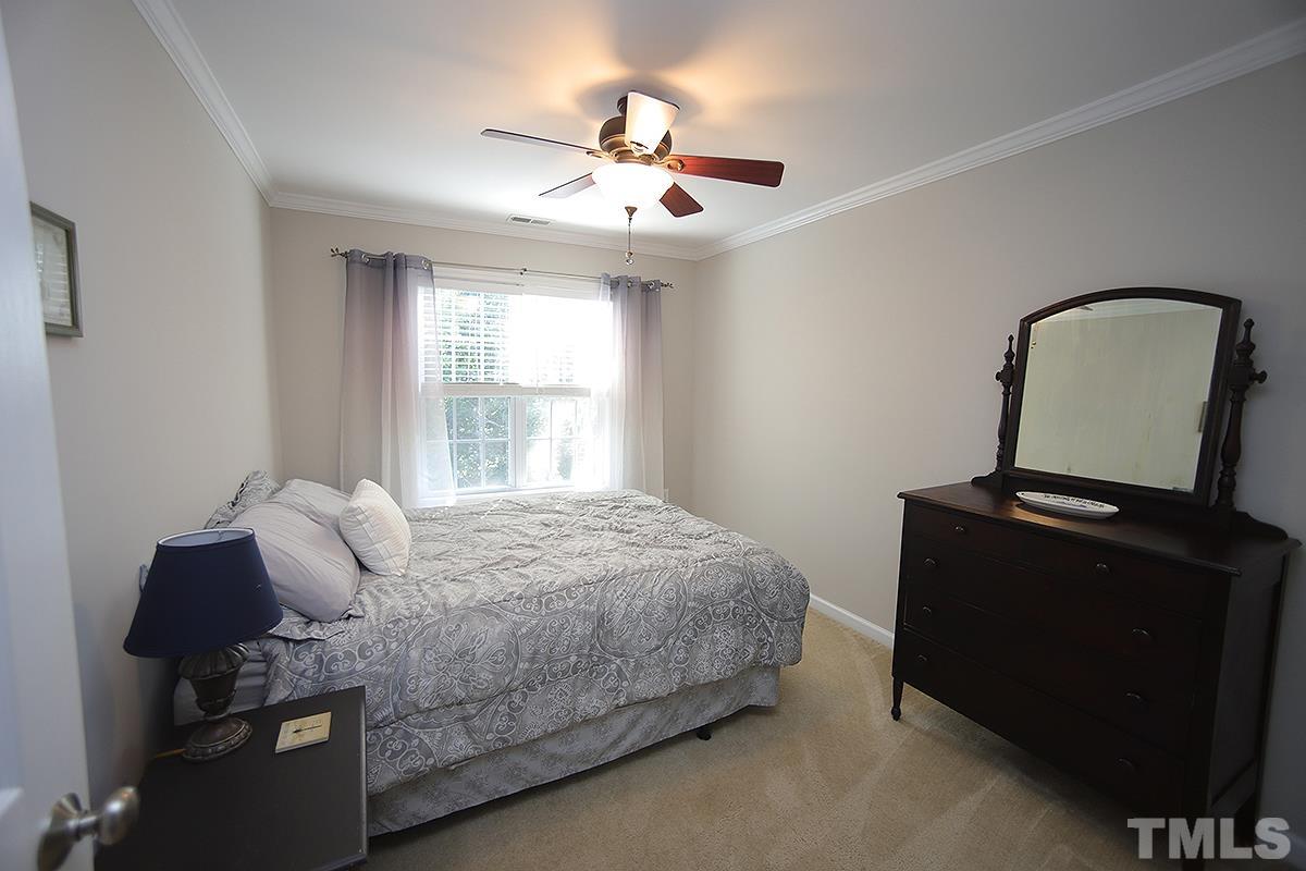 2656 Andover Glen Road Raleigh, NC 27604 - Photo 12 of 18 a bedroom with a bed and window