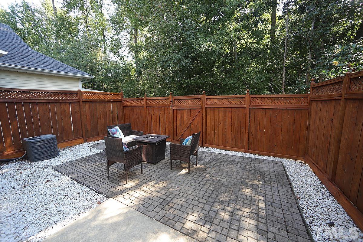 2656 Andover Glen Road Raleigh, NC 27604 - Photo 14 of 18 a view of backyard with outdoor seating
